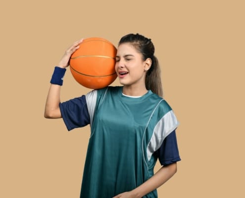 a girl holding a basketball