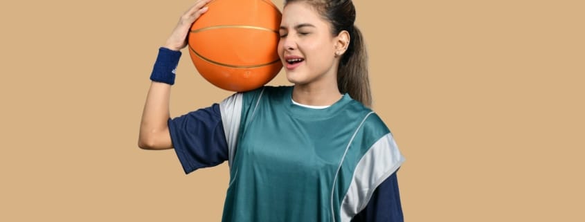 a girl holding a basketball