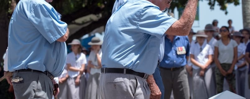 people standing near trees during day