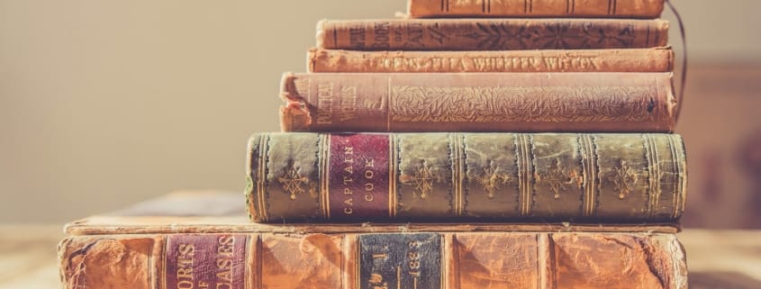 shallow focus photography of stack of books
