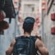 man holding black backpack