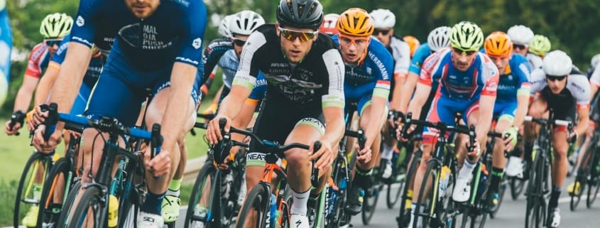 group of cyclist on asphalt road